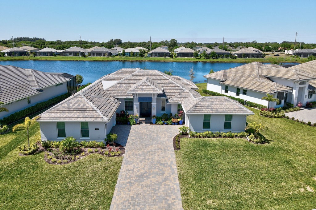 a front view of house with yard and outdoor seating