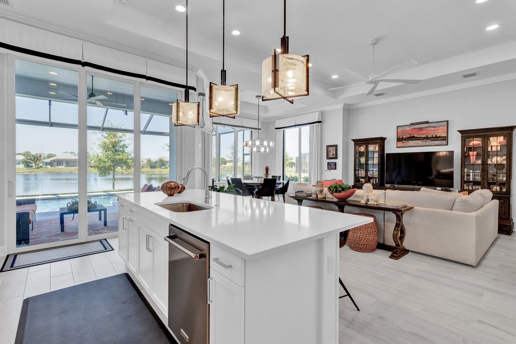 5594 Bent Pine Square Vero Beach, FL 32967 - Photo 15 of 35 a large kitchen with kitchen island a large island in it
