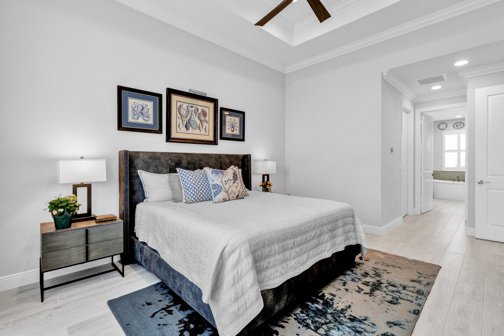 5594 Bent Pine Square Vero Beach, FL 32967 - Photo 17 of 35 a bedroom with bed and painting on the wall