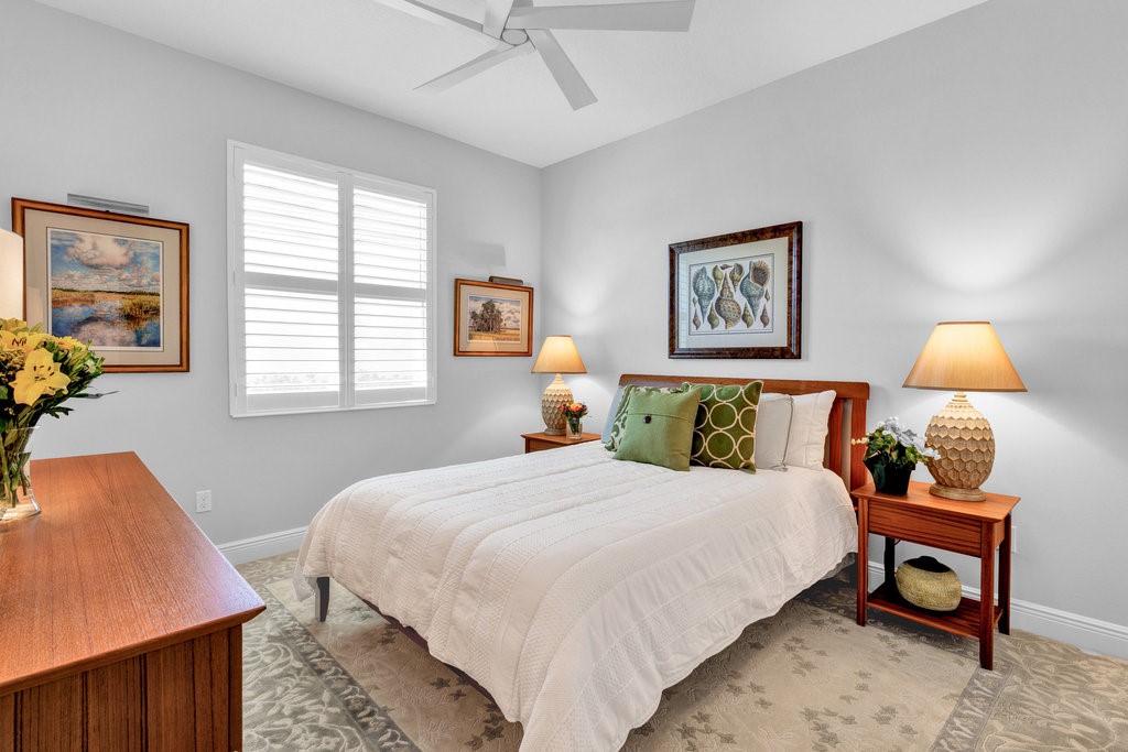 5594 Bent Pine Square Vero Beach, FL 32967 - Photo 20 of 35 a bedroom with bed and a window