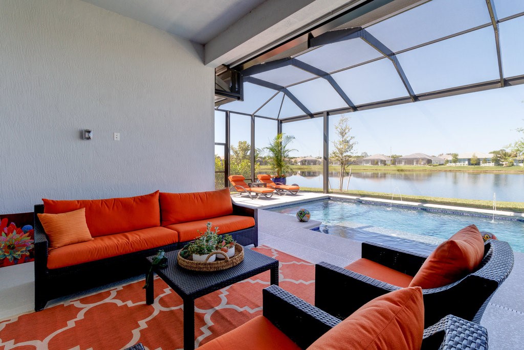 5594 Bent Pine Square Vero Beach, FL 32967 - Photo 32 of 35 a outdoor living space with furniture and a rug