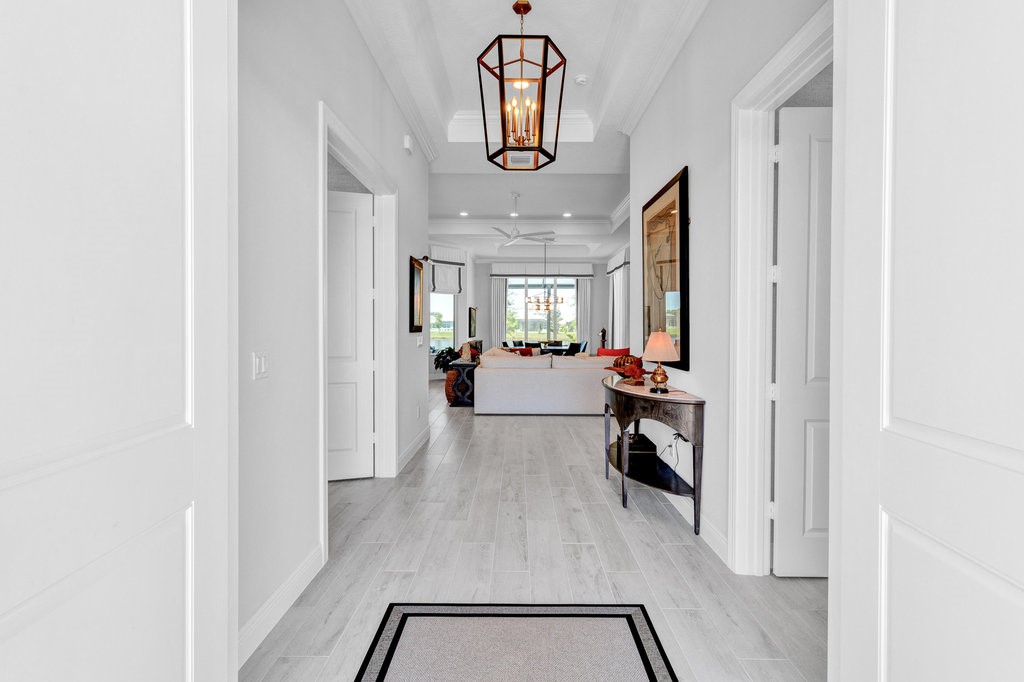 5594 Bent Pine Square Vero Beach, FL 32967 - Photo 4 of 35 view of hall way with mirror