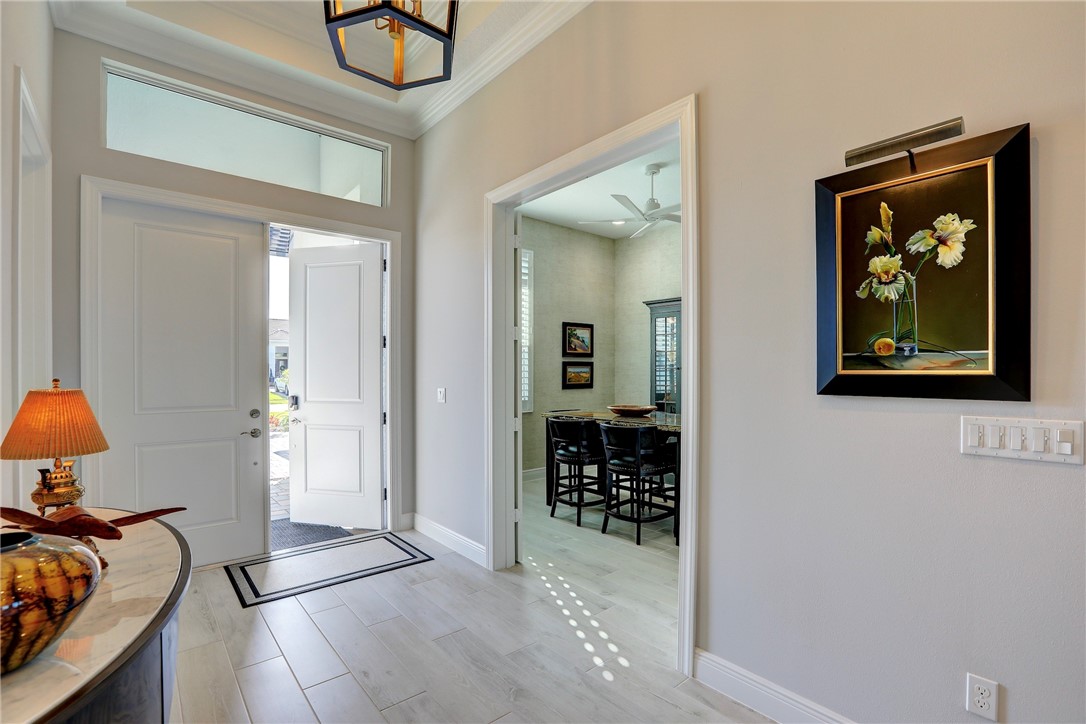 5594 Bent Pine Square Vero Beach, FL 32967 - Photo 5 of 35 a view of a hallway view with living room and furniture