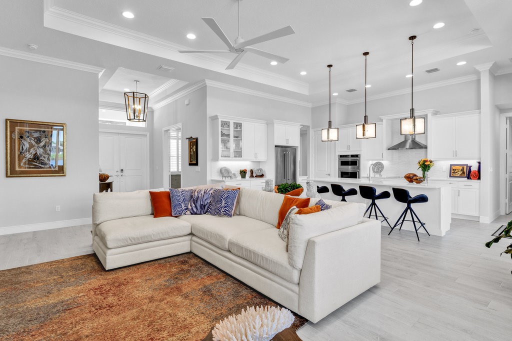 5594 Bent Pine Square Vero Beach, FL 32967 - Photo 8 of 35 a living room with furniture and a large window