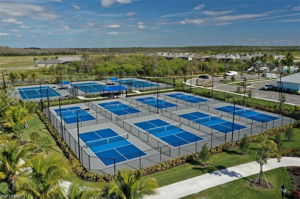 28165 Captiva Shell Loop Bonita Springs, FL 34135 - Photo 33 of 38 a view of a swimming pool and outdoor seating