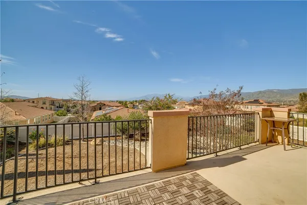 a view of a balcony with city