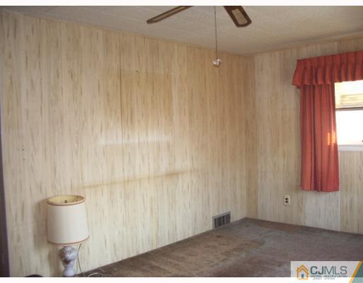 21 Wilcox Road New Brunswick, NJ 08901 - Photo 2 of 10 a view of a room with a window and wooden floor