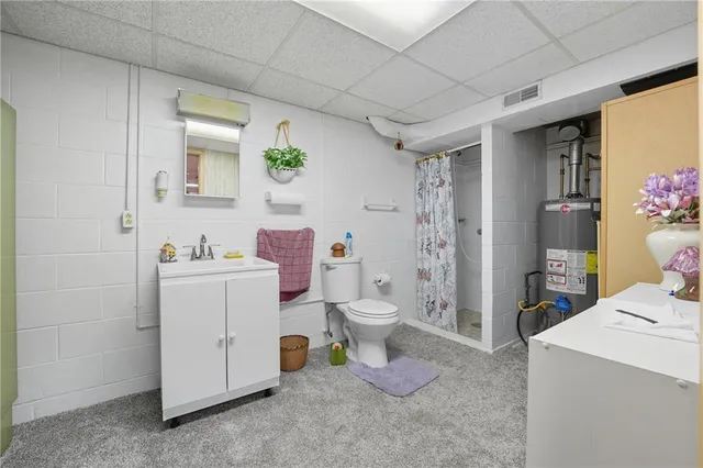 a view of bathroom with a sink toilet and shower