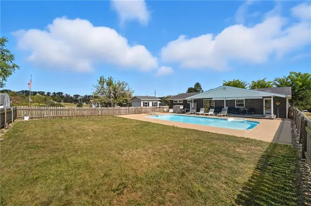 a view of a lake with houses in the background