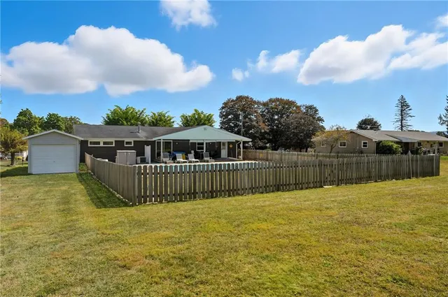 a view of a deck with a big yard
