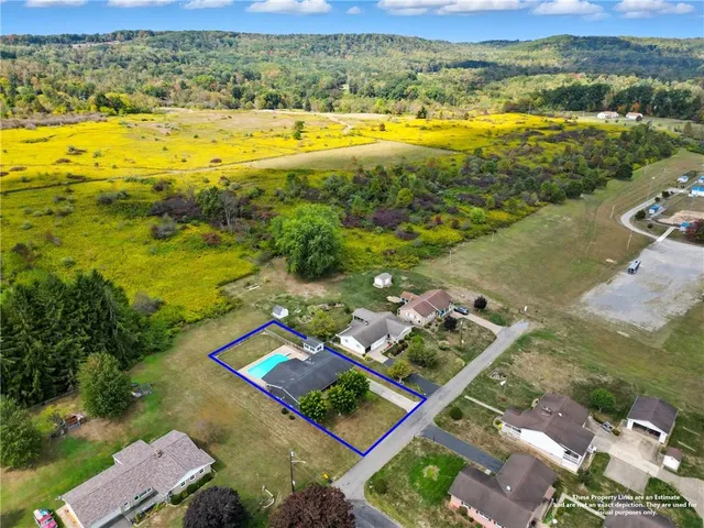 an aerial view of a house with a lake view