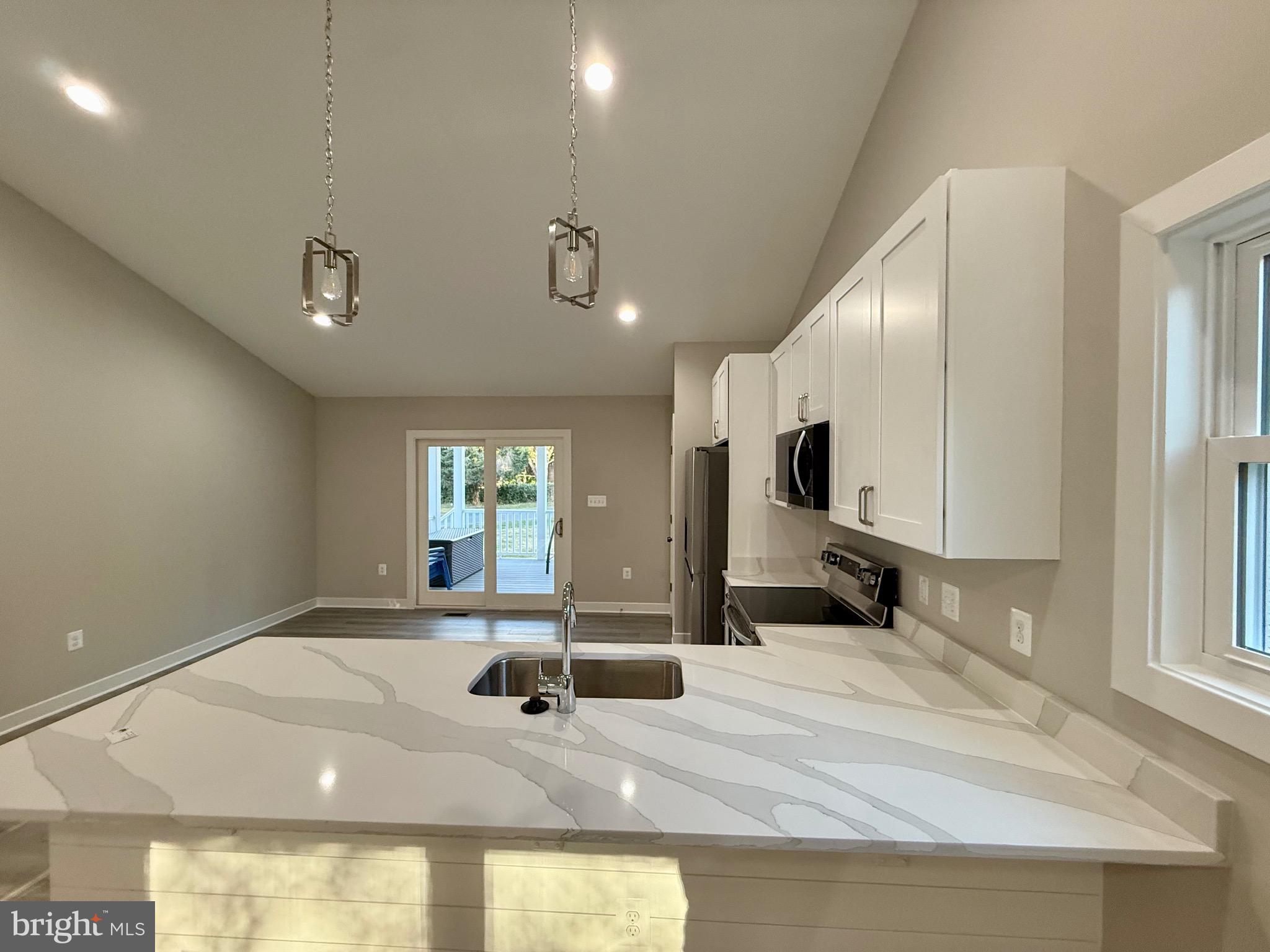 982 Mattox Avenue Colonial Beach, VA 22443 - Photo 15 of 53 a bathroom with a tub sink and mirror