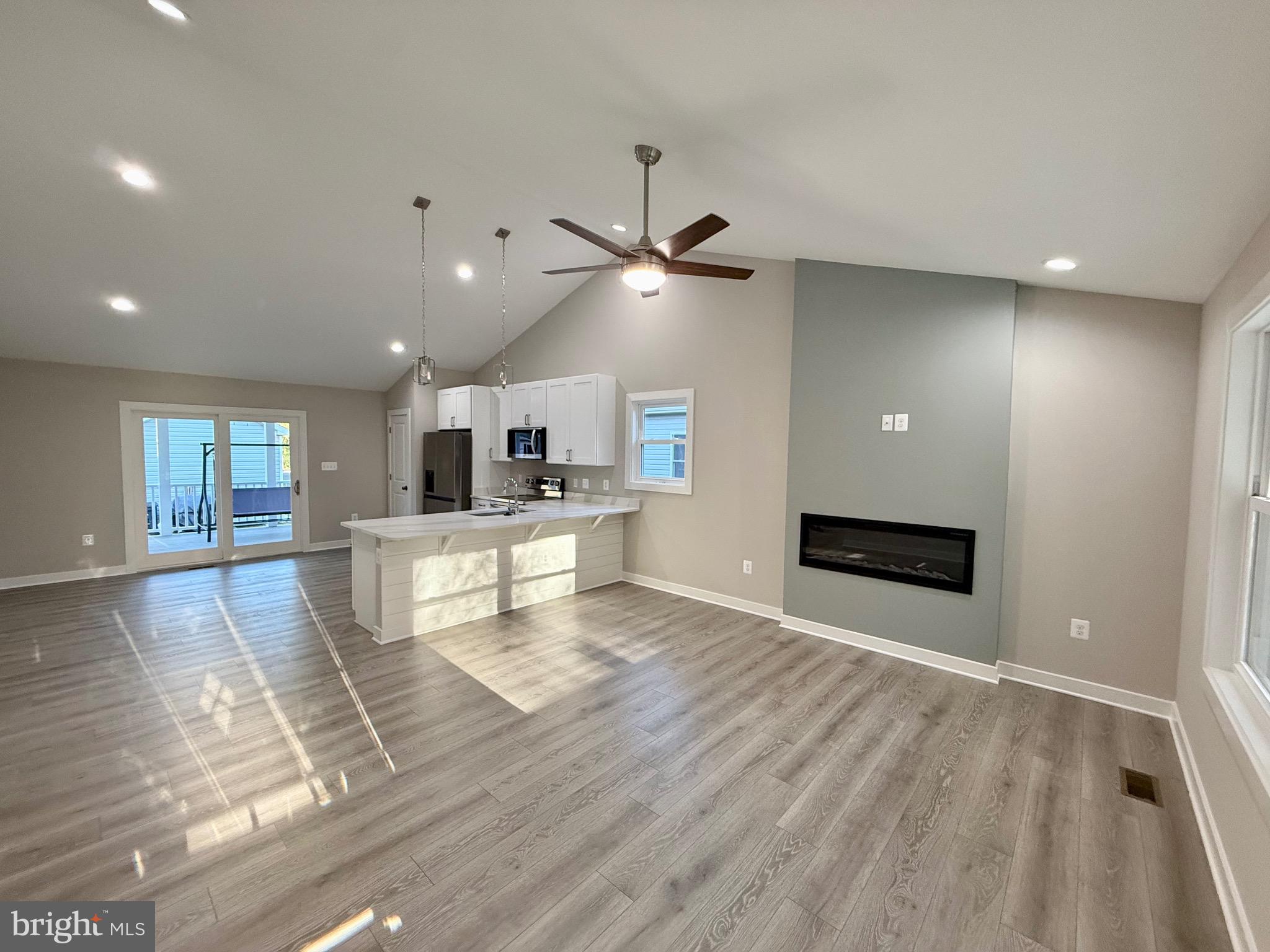 982 Mattox Avenue Colonial Beach, VA 22443 - Photo 17 of 53 a view of a living room and a kitchen with a sink