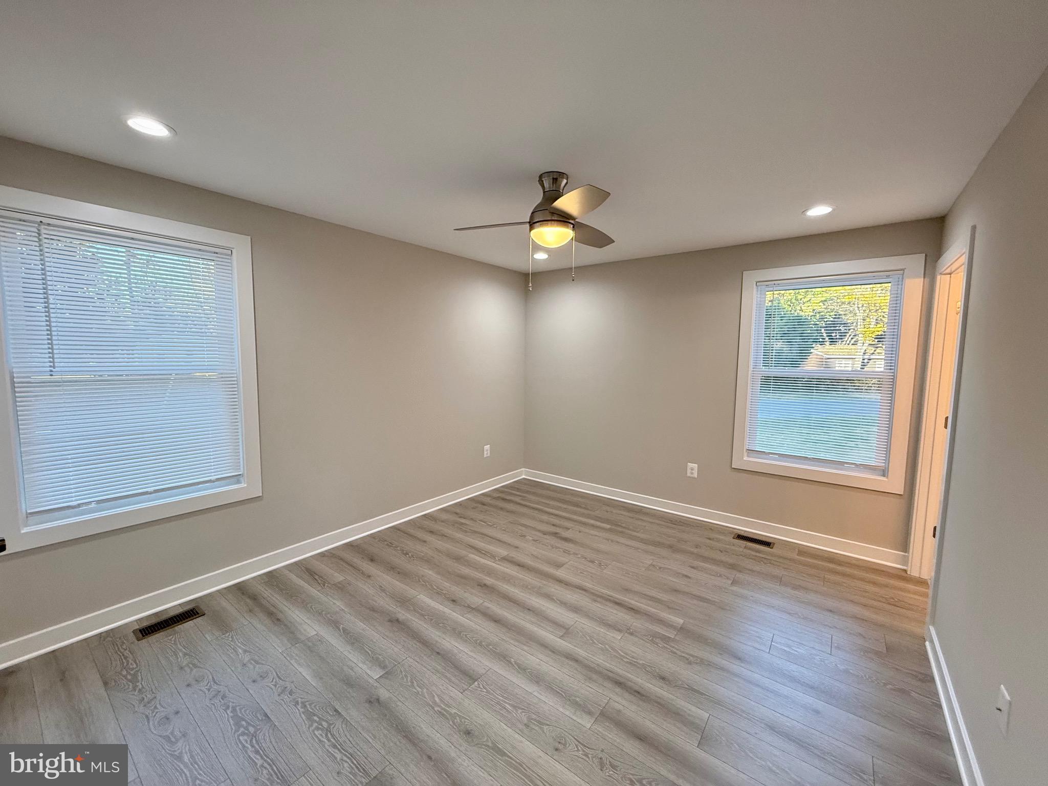 982 Mattox Avenue Colonial Beach, VA 22443 - Photo 18 of 53 an empty room with a window and a ceiling fan