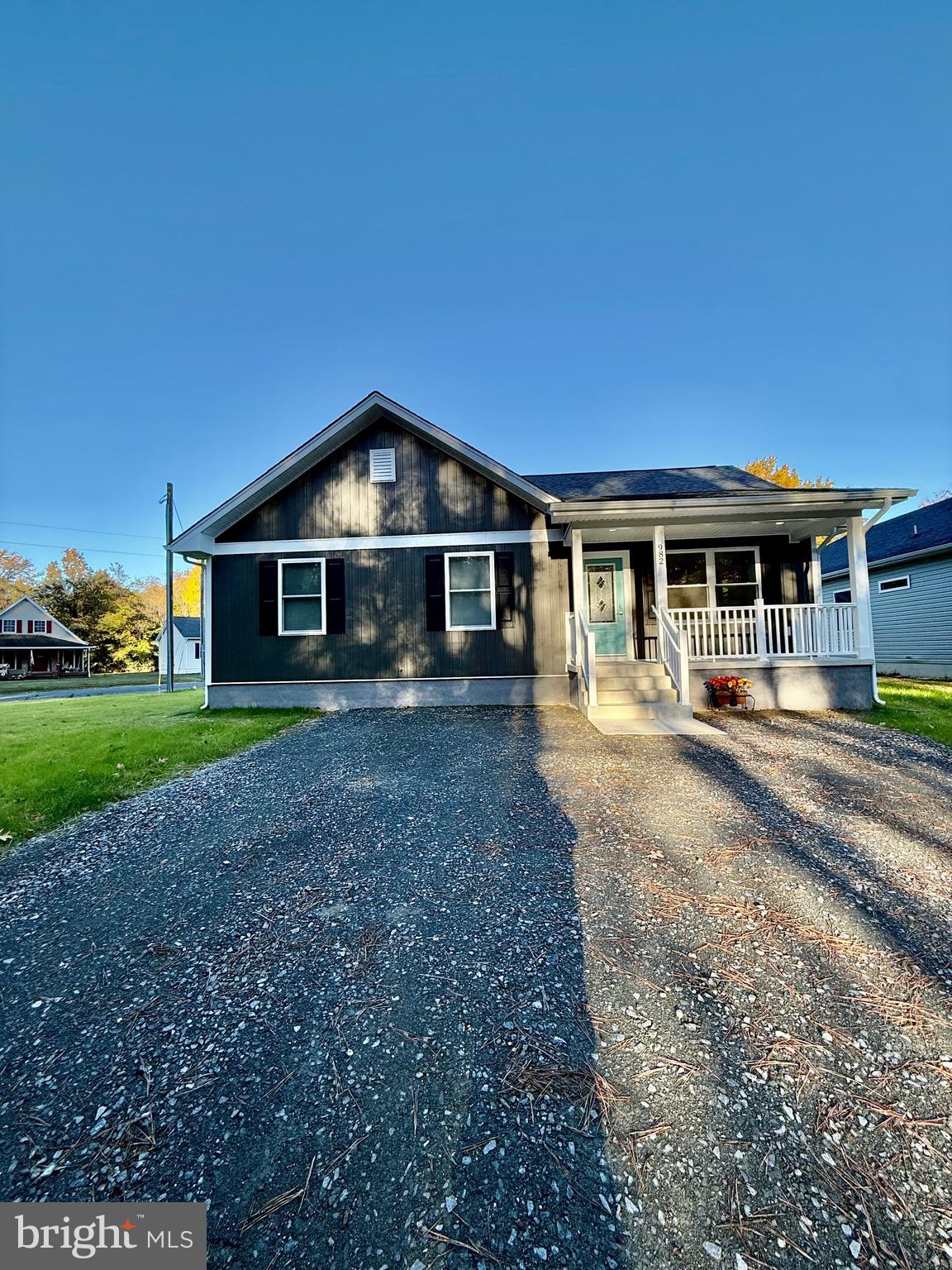 982 Mattox Avenue Colonial Beach, VA 22443 - Photo 4 of 53 a front view of a house with a yard