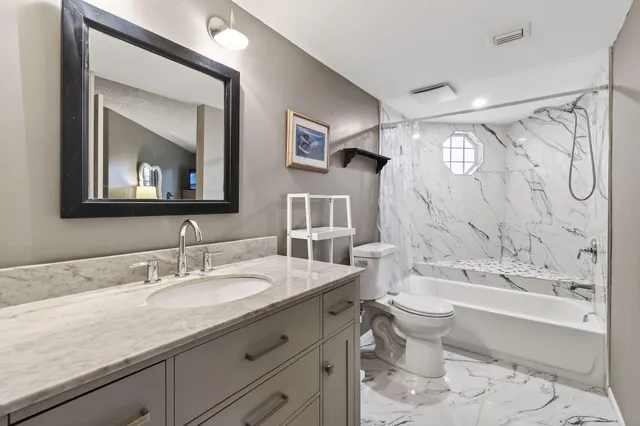 a bathroom with a shower and a toilet