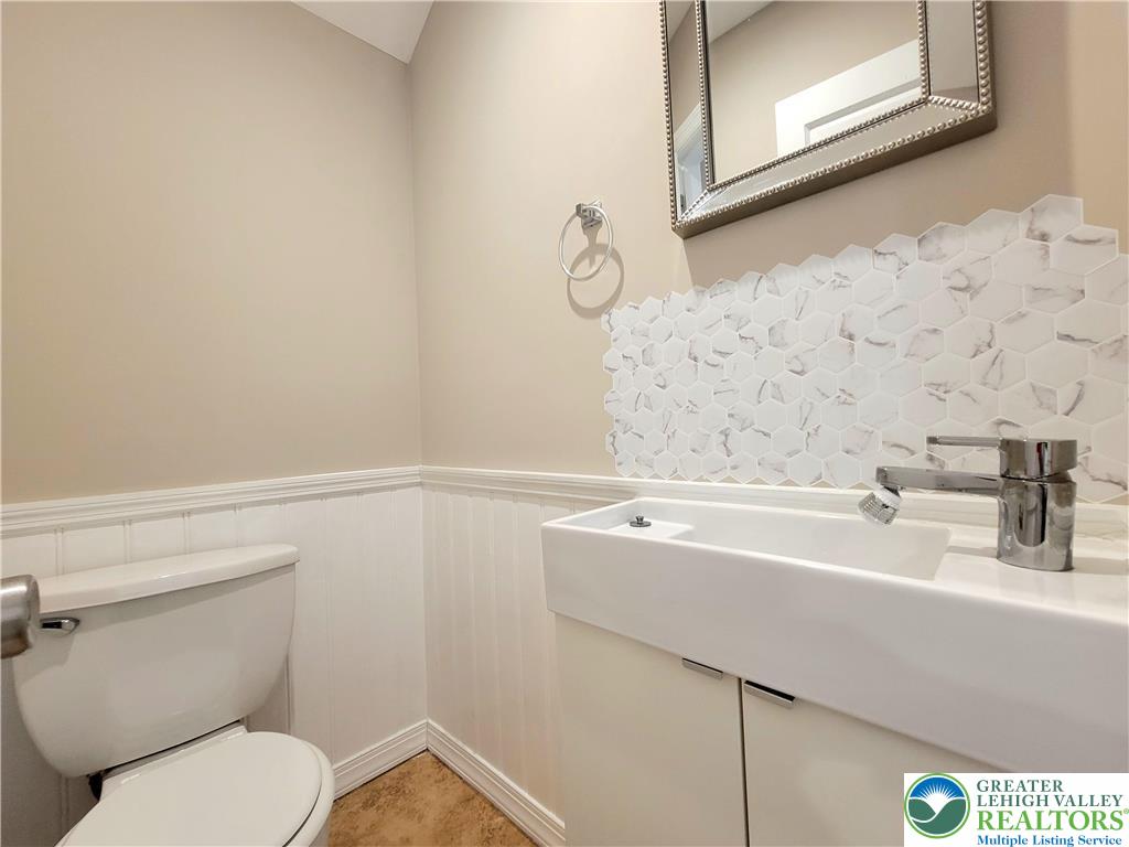 867 Underwood Road West East Stroudsburg, PA 18302 - Photo 12 of 28 a bathroom with a sink a toilet and mirror