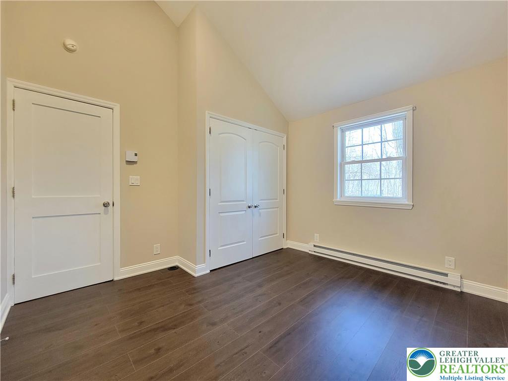 867 Underwood Road West East Stroudsburg, PA 18302 - Photo 14 of 28 an empty room with wooden floor and windows