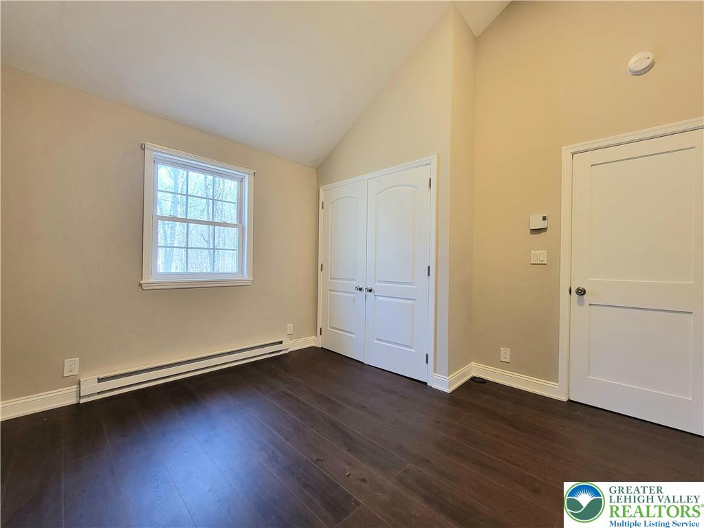 867 Underwood Road West East Stroudsburg, PA 18302 - Photo 16 of 28 an empty room with wooden floor and windows