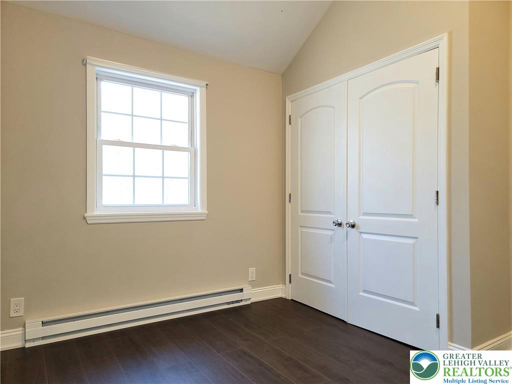 867 Underwood Road West East Stroudsburg, PA 18302 - Photo 17 of 28 an empty room with wooden floor and windows