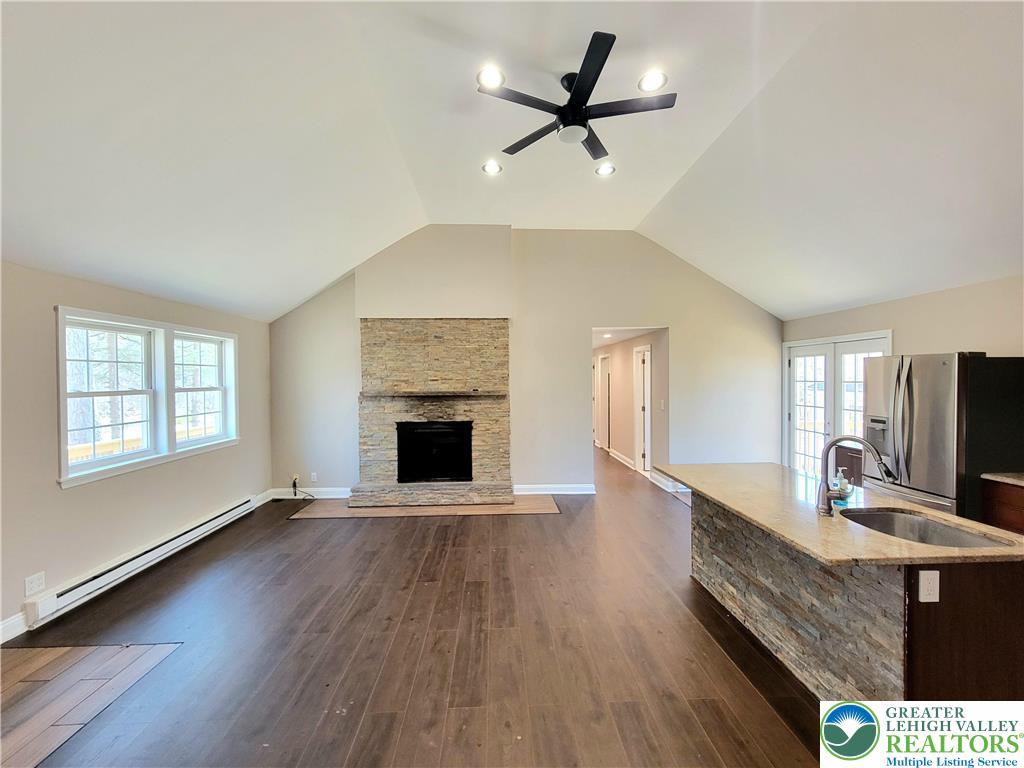 867 Underwood Road West East Stroudsburg, PA 18302 - Photo 7 of 28 a living room with furniture and a fireplace