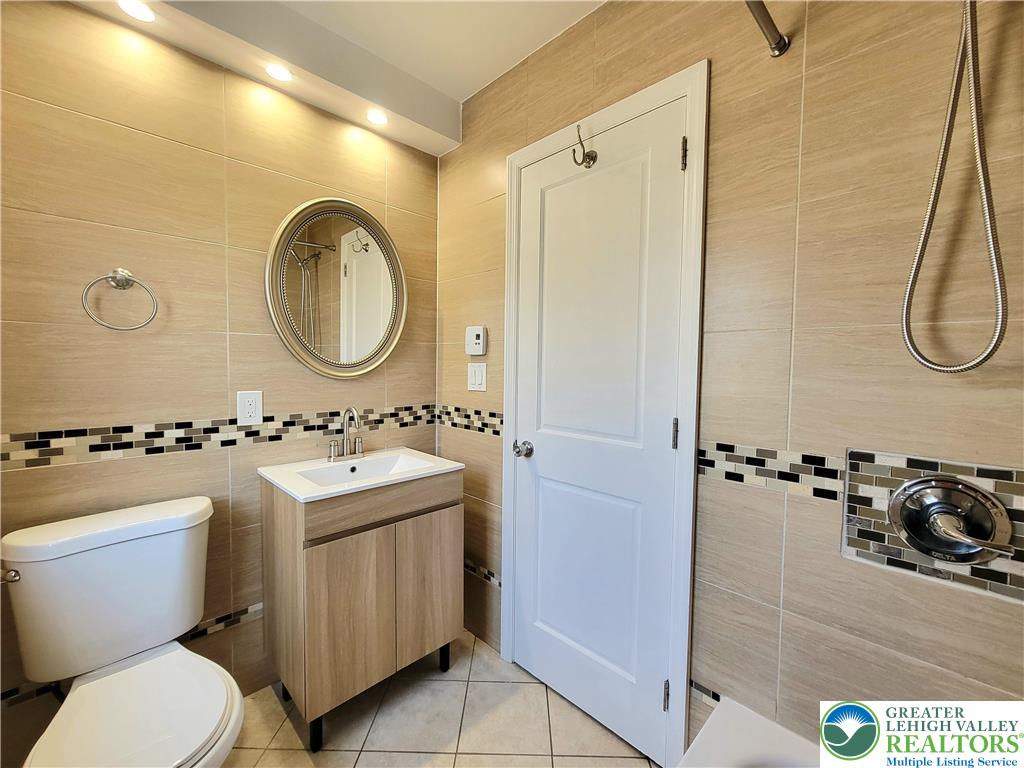 867 Underwood Road West East Stroudsburg, PA 18302 - Photo 8 of 28 a bathroom with a toilet sink and mirror