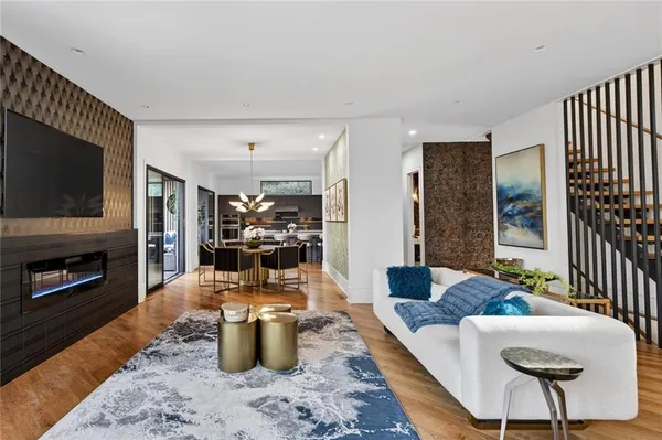 a dining room with furniture and wooden floor