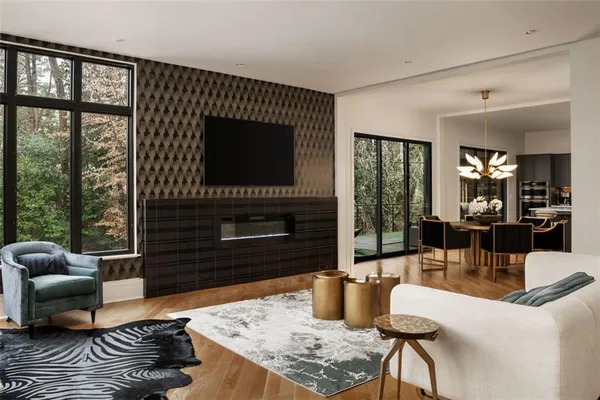 a kitchen with stainless steel appliances granite countertop a stove a refrigerator a sink a dining table and chairs with wooden floor