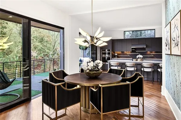 a kitchen with sink a counter top space and stainless steel appliances