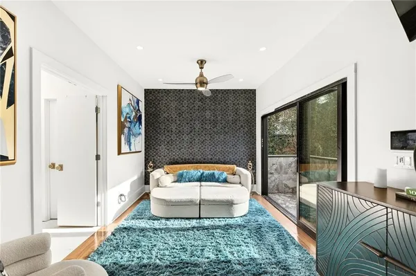 a bedroom with a bed and a mirror