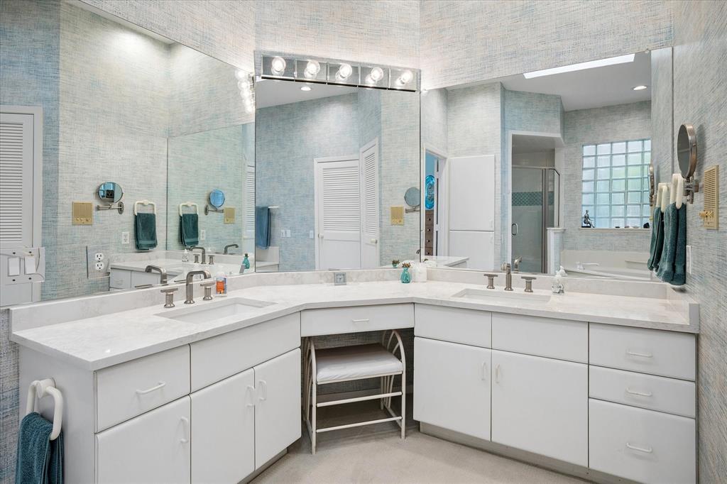 6419 Laurel Valley Road Dallas, TX 75248 - Photo 16 of 34 a bathroom with a sink and a mirror