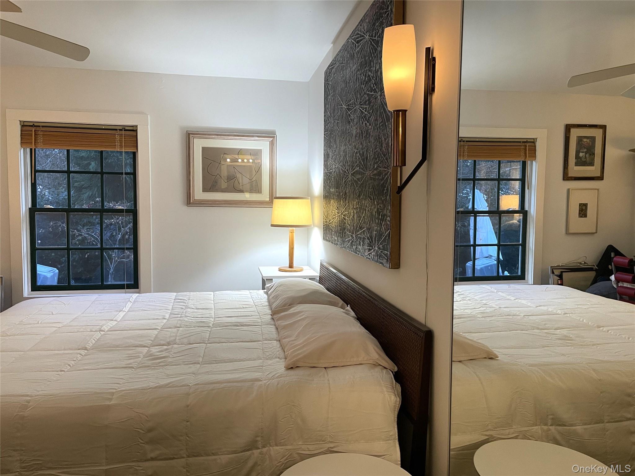 21 North Sea Road Southampton, NY 11968 - Photo 11 of 15 a bedroom with a large bed and a window