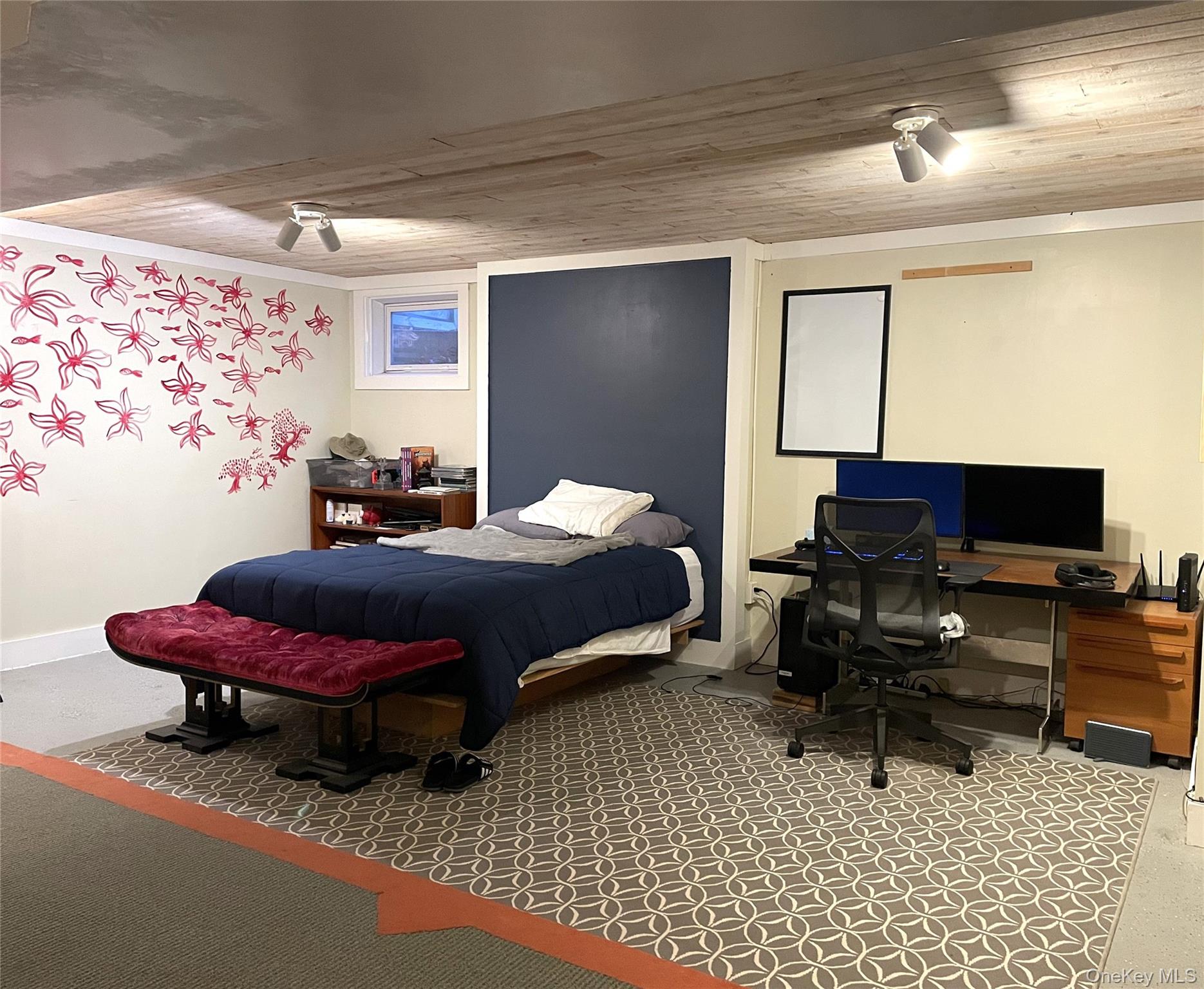 21 North Sea Road Southampton, NY 11968 - Photo 13 of 15 a bedroom with a bed a desk and chair