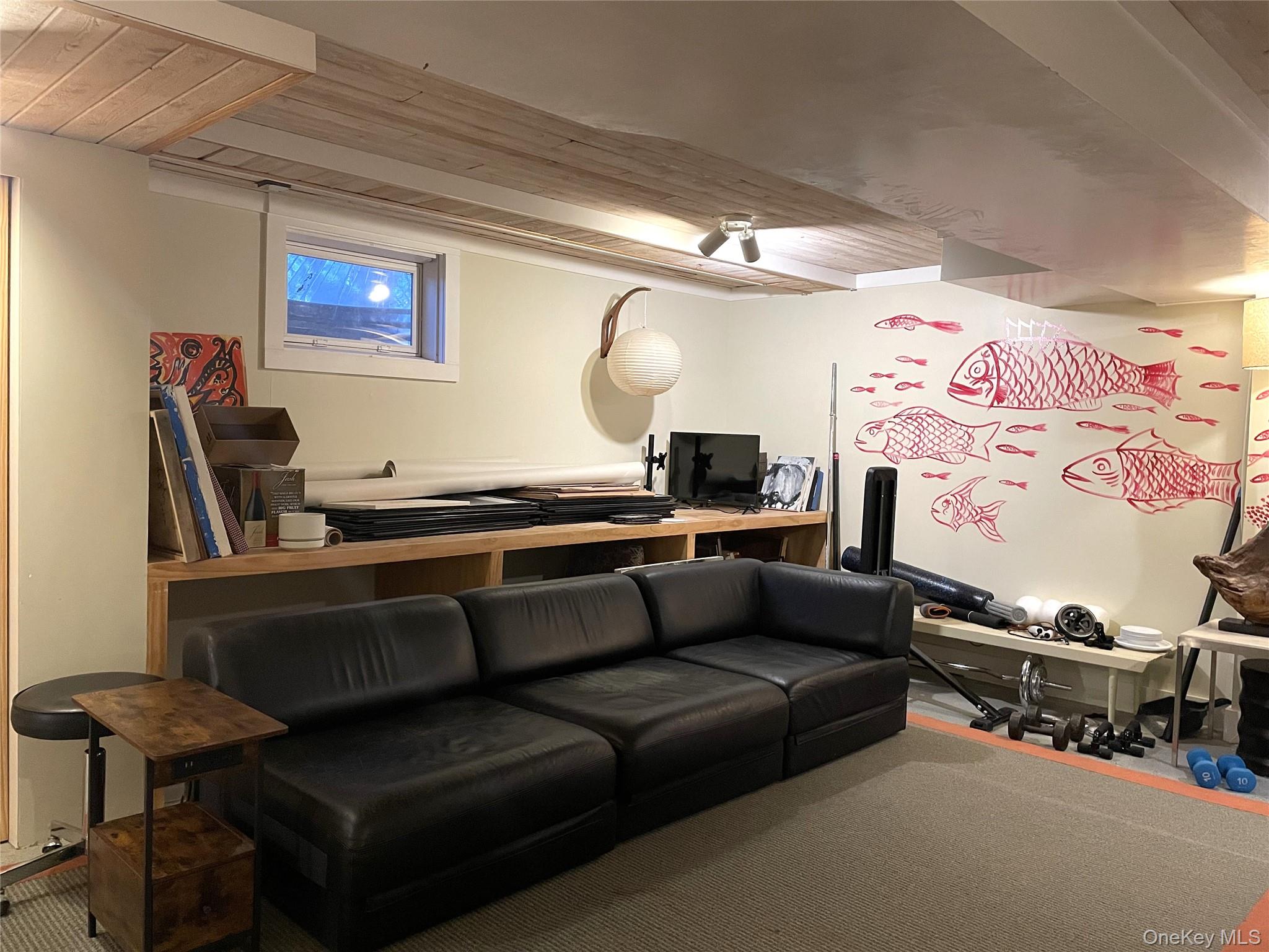 21 North Sea Road Southampton, NY 11968 - Photo 14 of 15 a living room with furniture and a flat screen tv