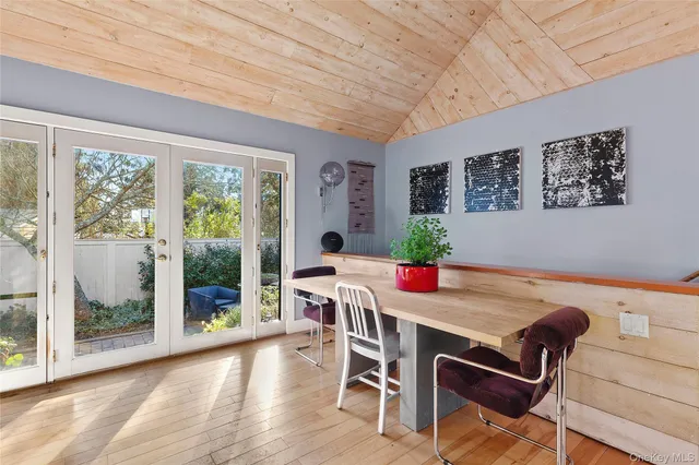 a dining room with furniture and window