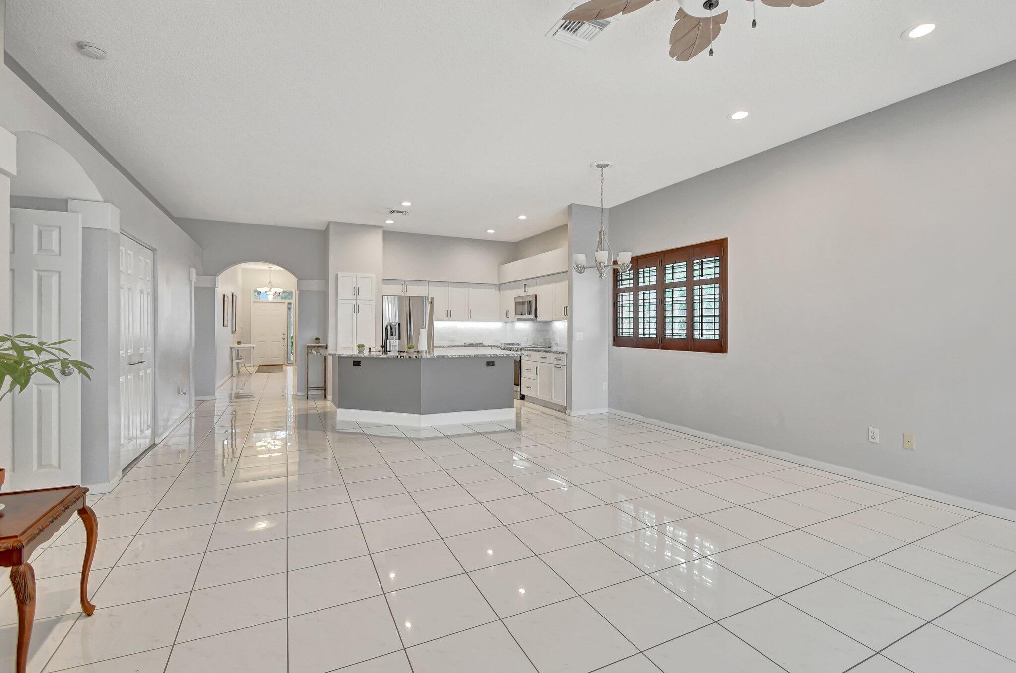 10929 Old Bridgeport Lane Boca Raton, FL 33498 - Photo 11 of 43 Living room looking at kitchen and front