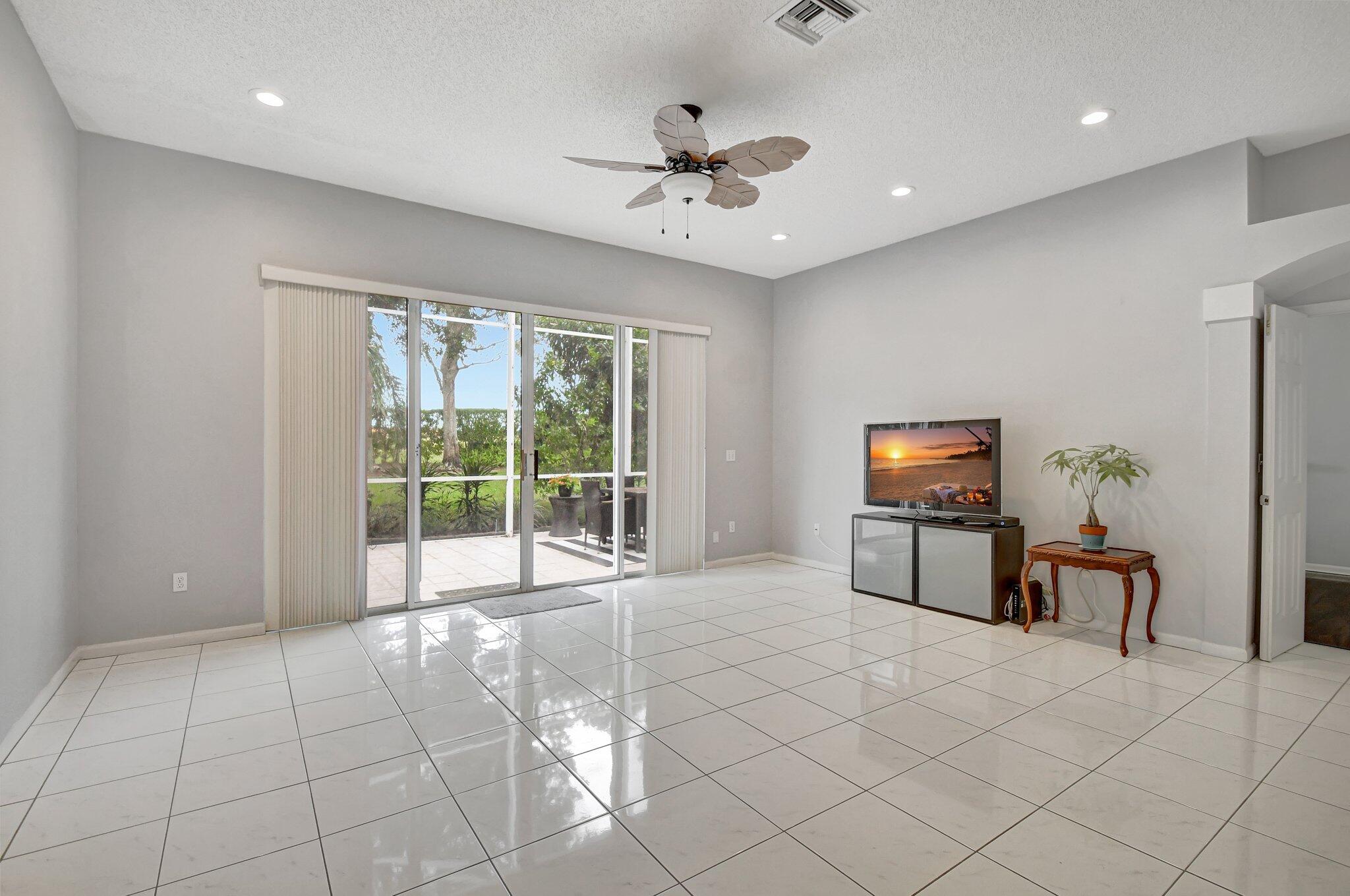10929 Old Bridgeport Lane Boca Raton, FL 33498 - Photo 12 of 43 Living room with patio 1