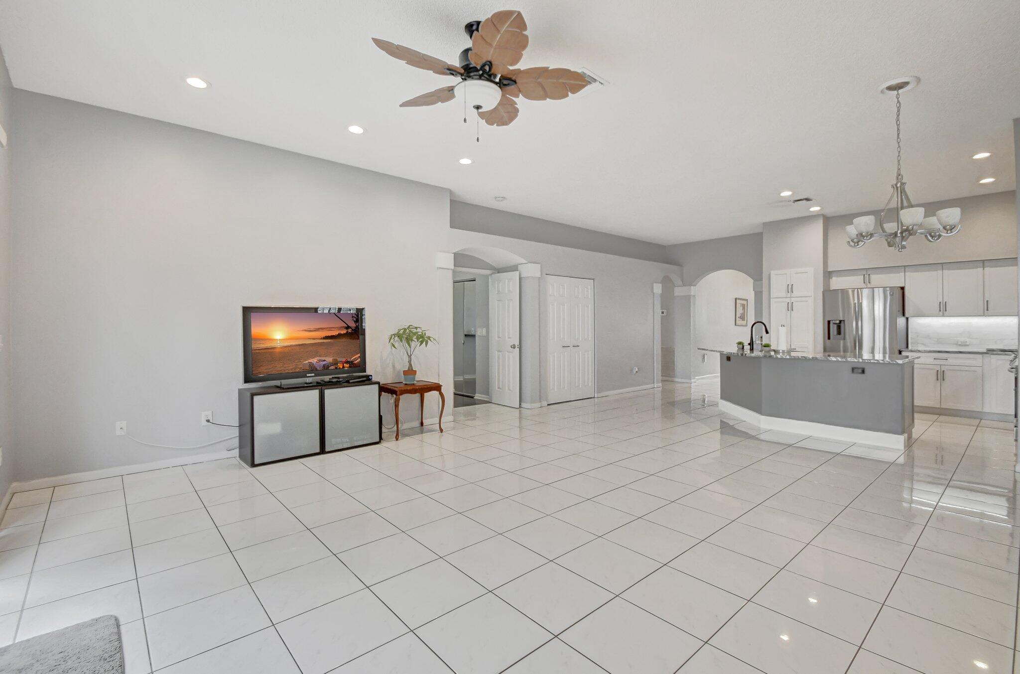 10929 Old Bridgeport Lane Boca Raton, FL 33498 - Photo 13 of 43 Living room from back looking at kitchen