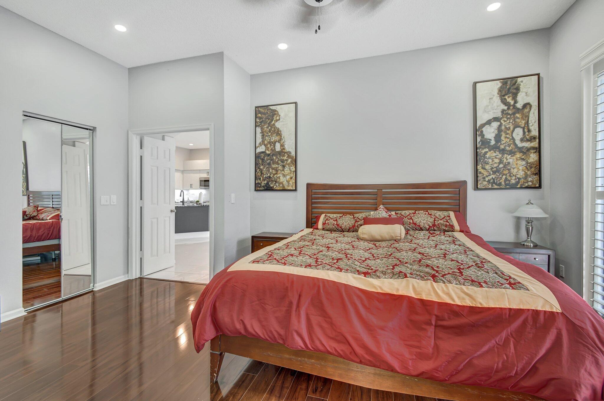 10929 Old Bridgeport Lane Boca Raton, FL 33498 - Photo 15 of 43 Primary showing bed ntst mirrored closet