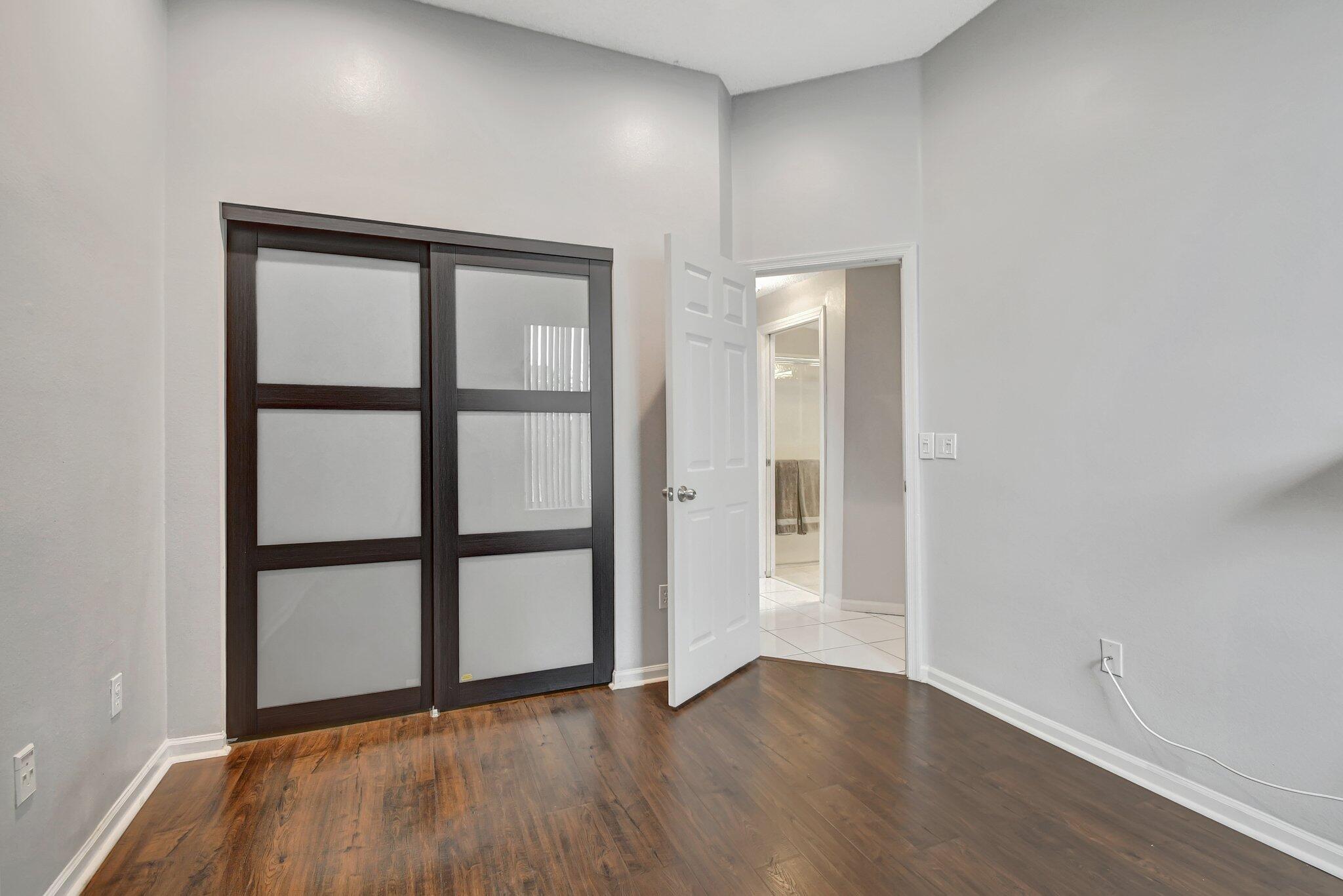 10929 Old Bridgeport Lane Boca Raton, FL 33498 - Photo 19 of 43 Jason's bedrm looking at closet and hall