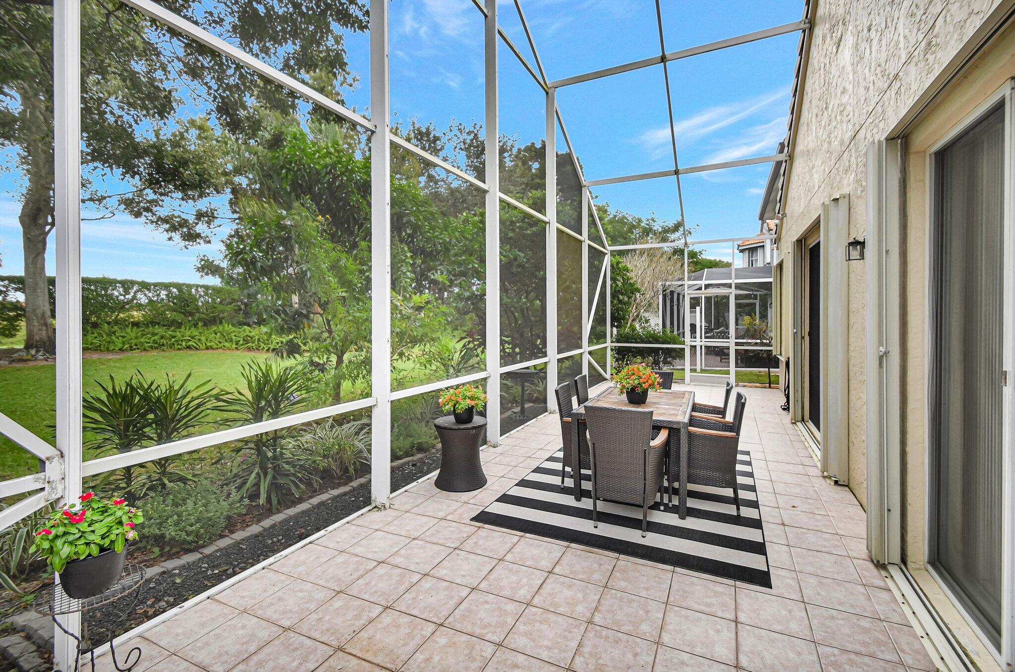 10929 Old Bridgeport Lane Boca Raton, FL 33498 - Photo 24 of 43 Patio showing flowers looking East towar