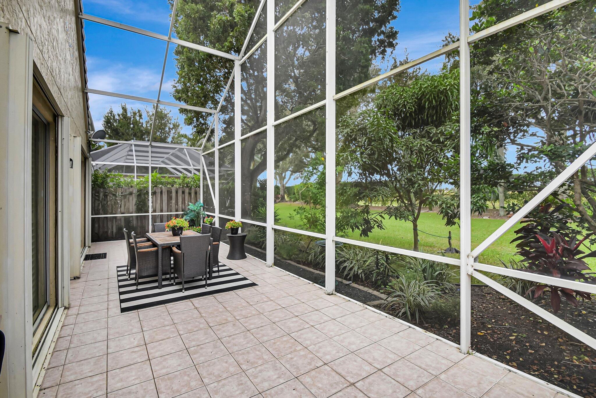 10929 Old Bridgeport Lane Boca Raton, FL 33498 - Photo 26 of 43 Patio from screen door rt side looking w