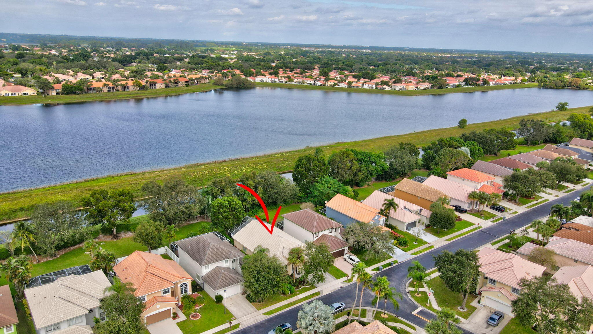 10929 Old Bridgeport Lane Boca Raton, FL 33498 - Photo 31 of 43 Drone showing home with arrow and lake a