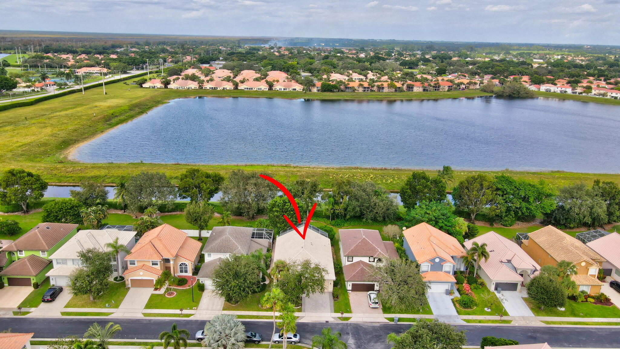 10929 Old Bridgeport Lane Boca Raton, FL 33498 - Photo 32 of 43 Drone showing home with arrow and lake