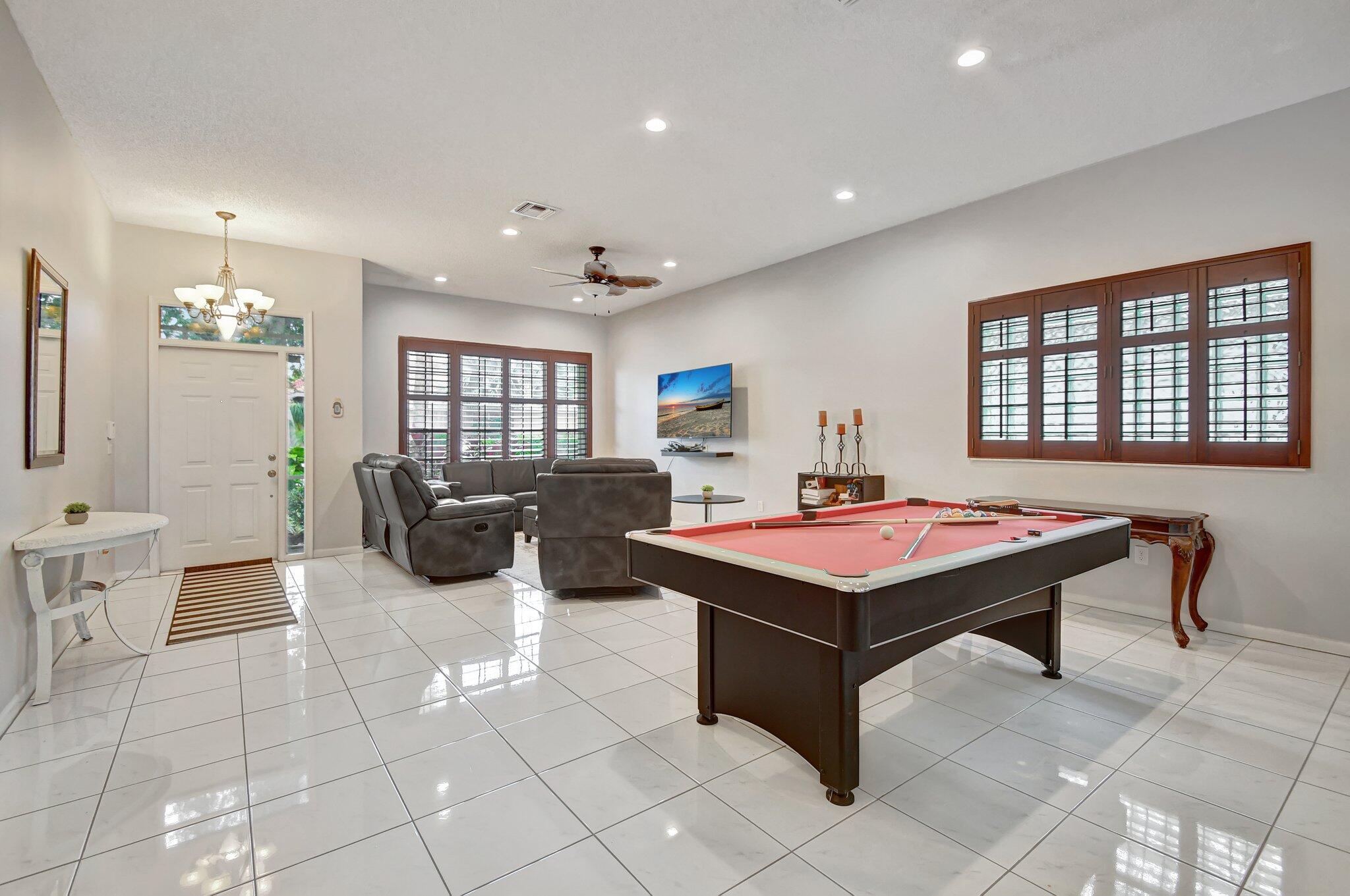 10929 Old Bridgeport Lane Boca Raton, FL 33498 - Photo 6 of 43 Family room and dining -pool table room