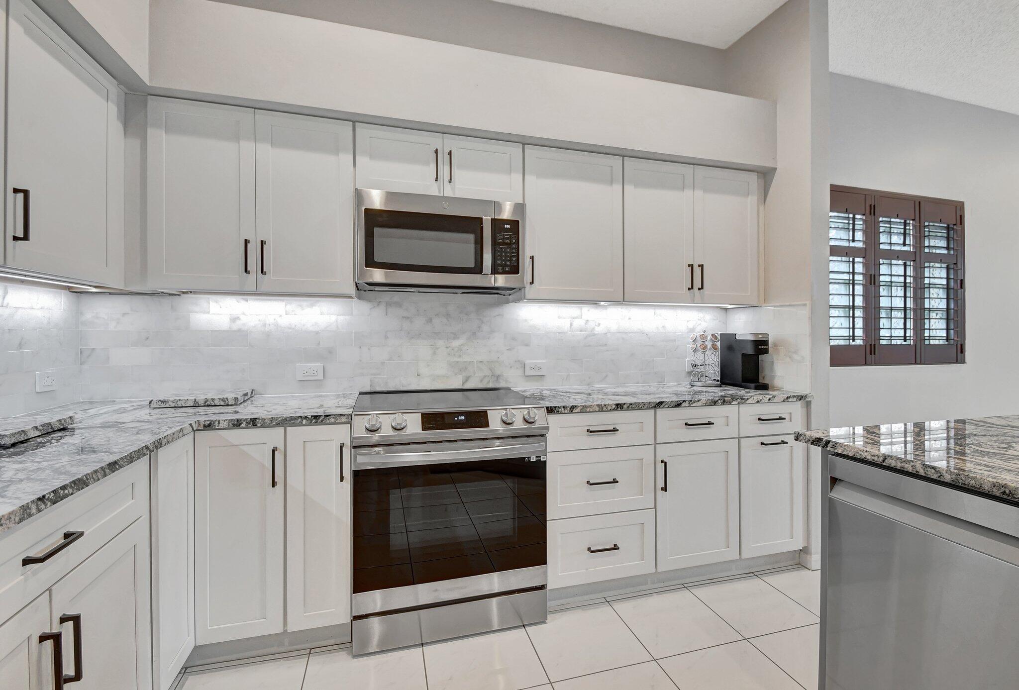 10929 Old Bridgeport Lane Boca Raton, FL 33498 - Photo 9 of 43 Kitchen looking at center granite coount