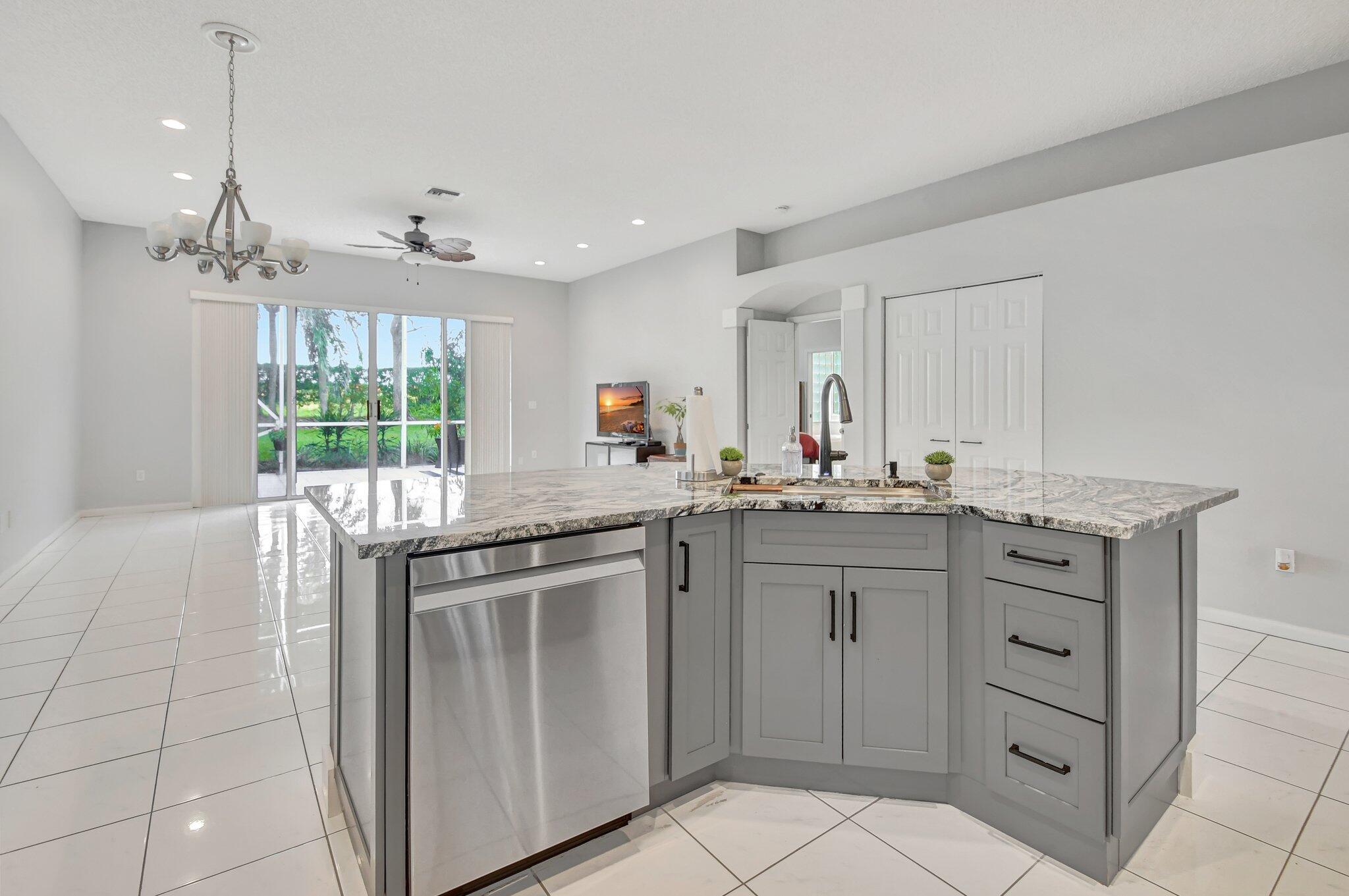 10929 Old Bridgeport Lane Boca Raton, FL 33498 - Photo 10 of 43 Kitchen looking out over island to livin