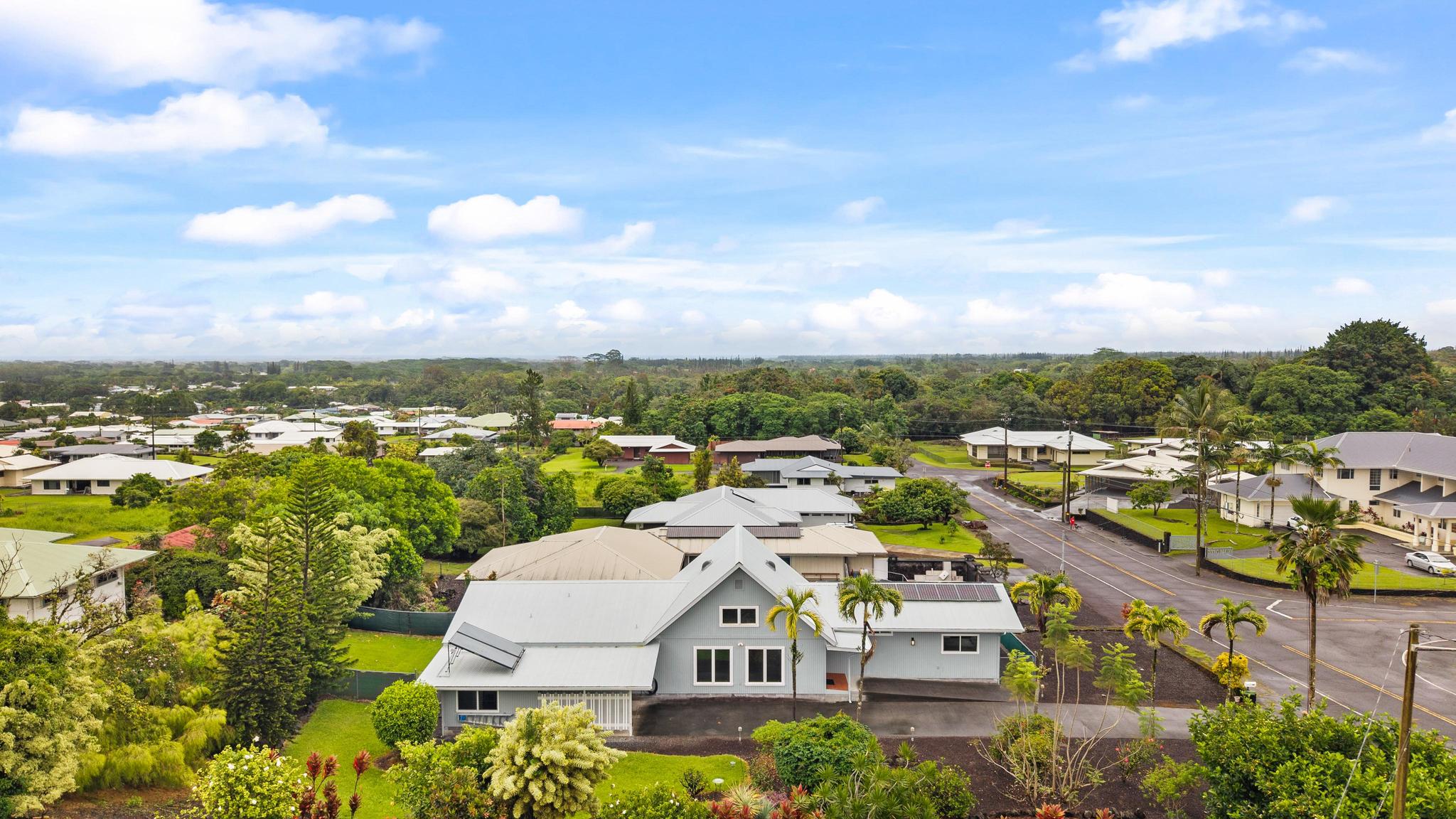 an aerial view of a house with a garden