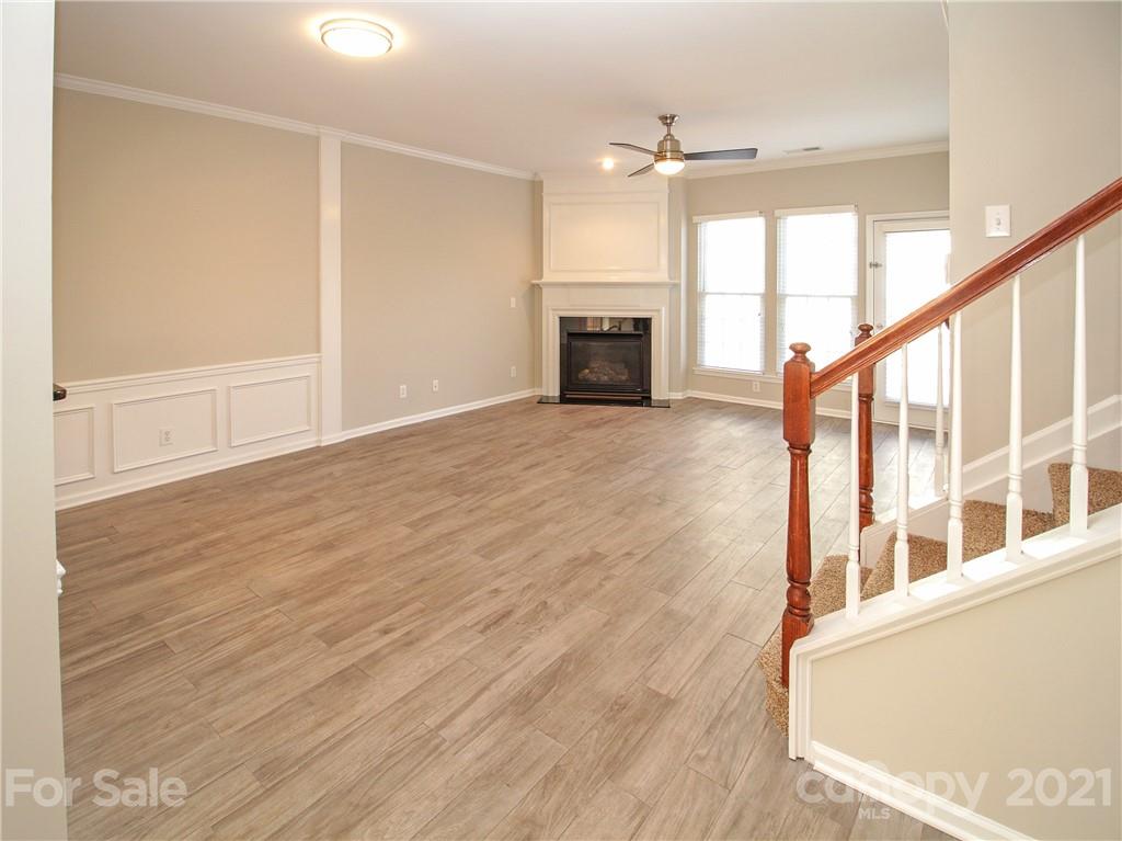 629 6th Baxter Crossing Fort Mill, SC 29708 - Photo 12 of 31 a view of an empty room with a window and fireplace