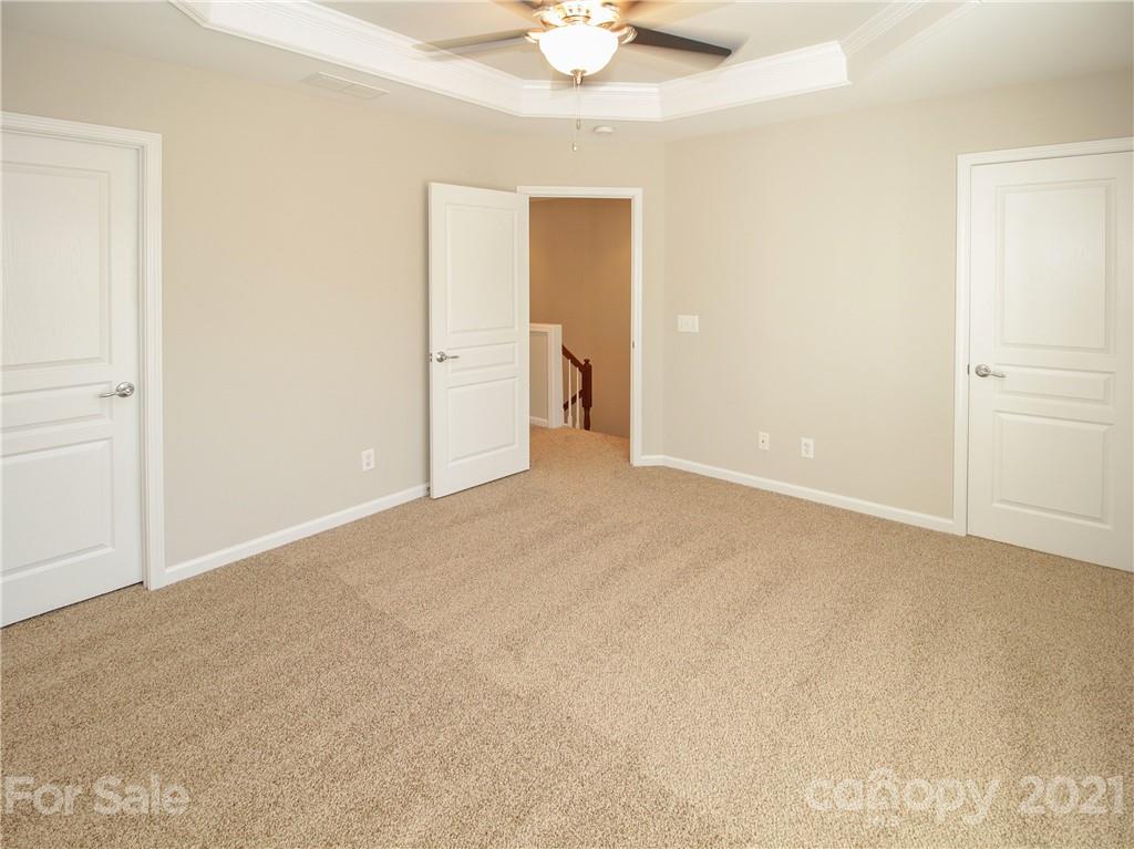 629 6th Baxter Crossing Fort Mill, SC 29708 - Photo 14 of 31 a view of an empty room with a chandelier